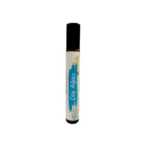Amber camda jojoba-çay ağacı roll-on, siyah kapaklı, beyaz etiket.